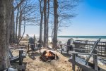 Fire pit overlooking Lake Michigan with Adirondack style chairs 